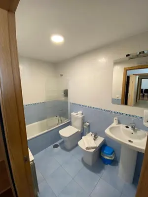 a bathroom with a toilet and a sink at dpCristal Calvo Sotelo 164, 4C in Sarria