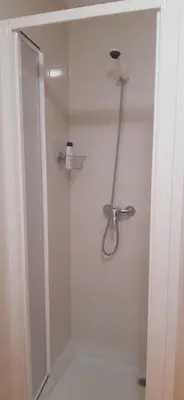 a shower with a glass door in a bathroom at Apartamento Alfa in Monforte de Lemos