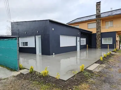 a flooded parking lot in front of a building at Lar de Yago - Apto Barreiros A in Barreiros