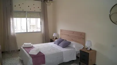 a bedroom with a large bed and a window at Dona Branca in Quiroga