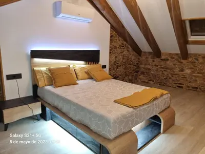 a bedroom with a bed in a room at Casa Grilo in Monforte de Lemos