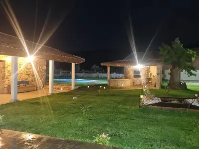 a house with a garden at night with lights at Casa Grilo in Monforte de Lemos