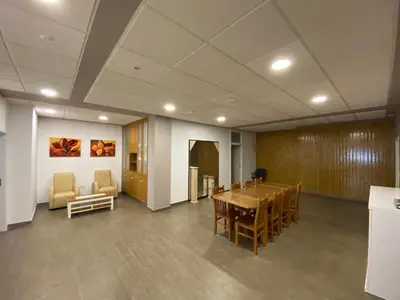 a conference room with a wooden table and chairs at dpCristal El Rinconcito in Sarria