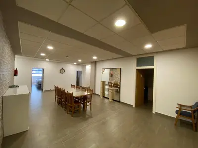 a large room with a table and chairs in it at dpCristal El Rinconcito in Sarria