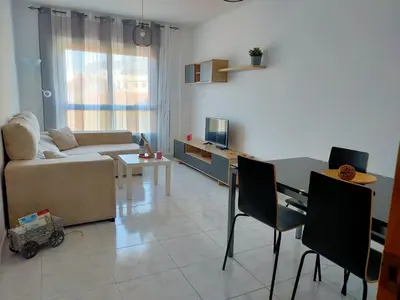 a living room with a couch and a table at Boa Vista Cerca del centro 2 hab y parking in Monforte de Lemos