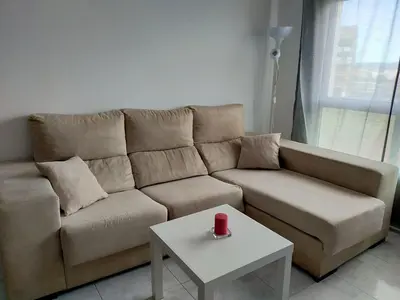 a living room with a couch and a coffee table at Boa Vista Cerca del centro 2 hab y parking in Monforte de Lemos