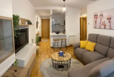 a living room with a couch and a table at VIANA in Monforte de Lemos