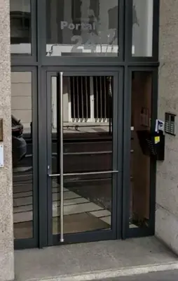 a glass door of a store with a sign on it at VIANA in Monforte de Lemos
