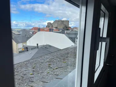 a view of a building from a window at Casa Manuela in Castro Caldelas