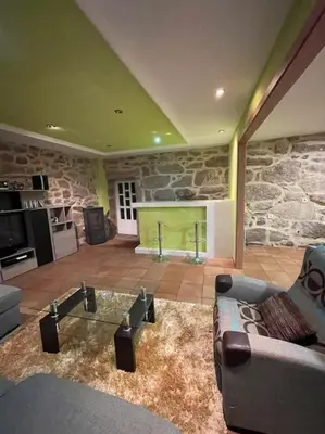 a living room with a couch and a glass table at Chalet casa con piscina en ARBO Vigo in Arbo