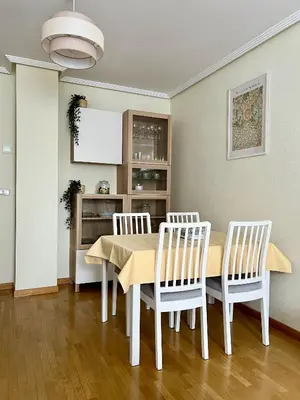 a dining room with a table and four chairs at BierzINN Alojamientos - Brujas in Ponferrada
