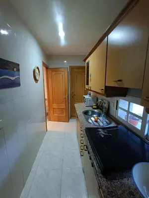 a kitchen with a sink and a counter top at O FOGAR DAS FINAS in Melias