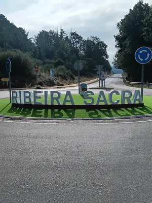 a sign on the side of a road at O FOGAR DAS FINAS in Melias