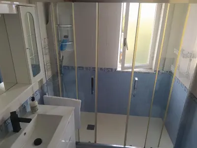 a bathroom with a shower and a sink at Tu piso en el Camino de Santiago in Sarria