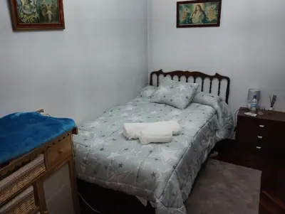 a bedroom with a bed with two towels on it at Casa Jesús in Sarria