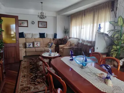 a living room with a table and a couch at Casa Jesús in Sarria