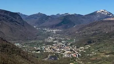 a town in the middle of a mountain range at VUT El Refugio in Villablino