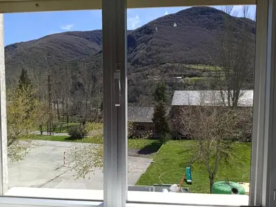 a window with a view of a mountain at VUT El Refugio in Villablino