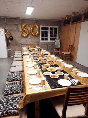 a long table with plates of food on it at Casona con Jacuzzi in Betanzos