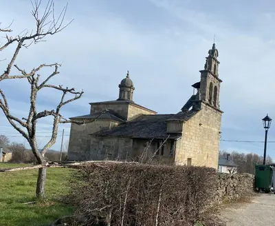 an old church with two towers on top of it at Casa Los Cuncos in Barrio de Lomba