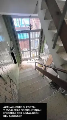 an overhead view of a staircase in a building at O cuarto de abastos in Ourense