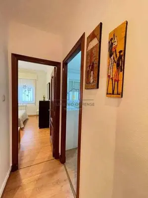 a hallway with two open doors to a room at O cuarto de abastos in Ourense