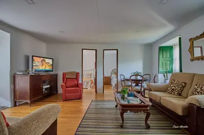 a living room with a couch and a table at Casa de Mila en Creciente Pontevedra in Crecíente