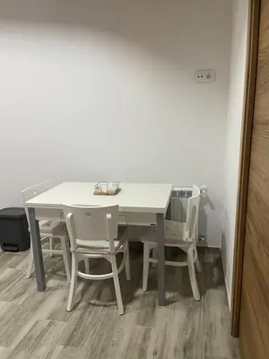 a white table and chairs in a room at Casa do Crego in Brañas