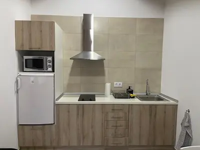 a kitchen with a white refrigerator and a microwave at Casa do Crego in Brañas