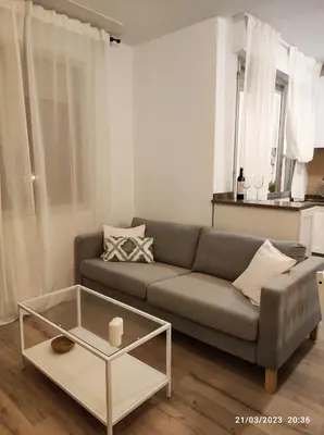 a living room with a couch and a coffee table at Casa Dina in Carballino