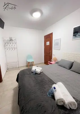 a bedroom with a bed with two towels on it at ACUBILLO in Palas de Rei