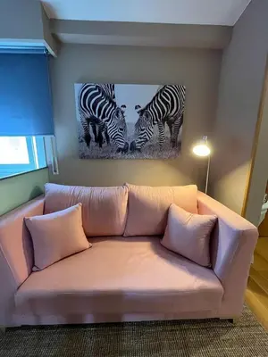 a living room with a table and a couch at Paz Termal in Ourense