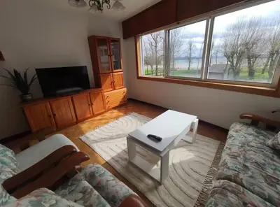 a living room with a couch and a coffee table at Ares-Mar in Ares
