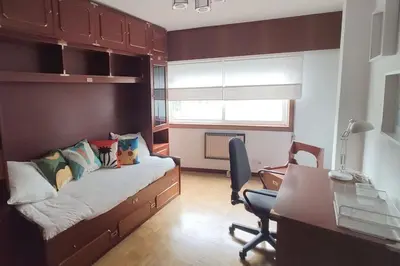 a bedroom with a bed and a desk and a desk at Ares-Mar in Ares