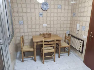 a table and chairs with a basket on top of it at Ares-Mar in Ares