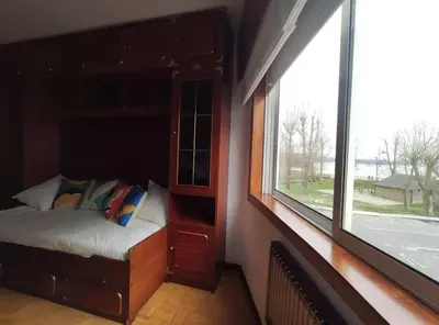 a small room with a bed and a window at Ares-Mar in Ares