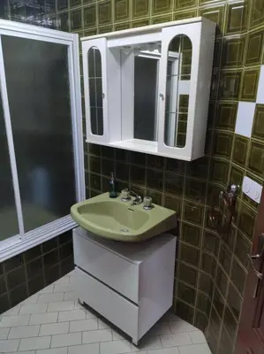 a bathroom with a sink and a mirror and a shower at Ares-Mar in Ares