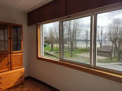 a room with three windows with a view of a yard at Ares-Mar in Ares