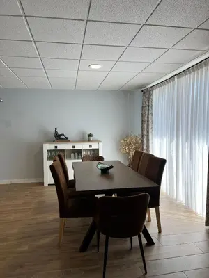 a dining room with a table and chairs at Fogar de Aurora in Portomarin