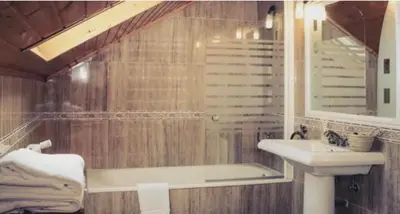 a bathroom with a sink and a bath tub at O Lagoeiro in A Estrada