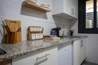 a kitchen with a counter top with a sink at FondeRiviere in Caldas de Reis