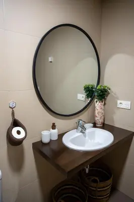 a bathroom with a sink and a large mirror at FondeRiviere in Caldas de Reis