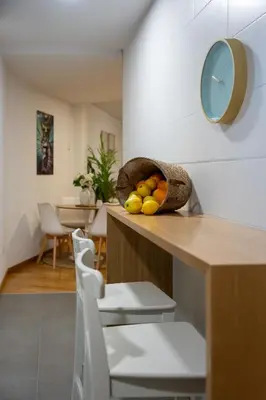 a bowl of fruit on a counter in a kitchen at FondeRiviere in Caldas de Reis