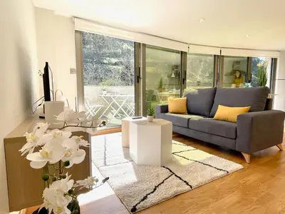 a living room with a couch and a table at The Cliffs - Montmar in Viveiro