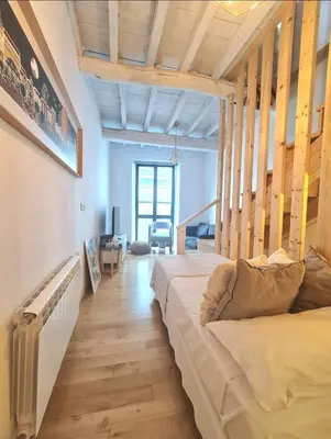 a bedroom with a large bed in a room at Casa típica Betanzos Casco Histórico in Betanzos
