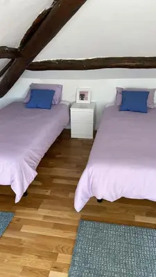 two beds sitting next to each other in a room at VILLA OLIMAR in San Juan de Prendones