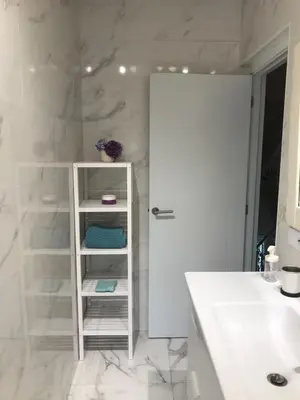 a bathroom with a white cabinet and a sink at VILLA OLIMAR in San Juan de Prendones