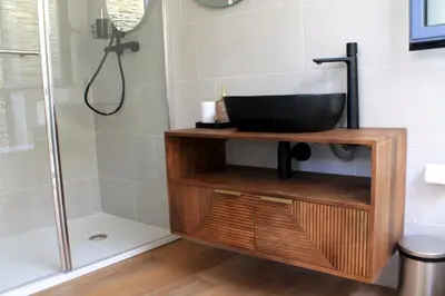 a bathroom with a sink and a shower at HOTEL CASAS DA FORTALEZA Casa da Solaina in Outeiro de Rei