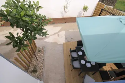 a garden with a bench and a potted plant at HOTEL CASAS DA FORTALEZA Casa do Garda in Outeiro de Rei