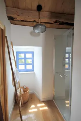 a bathroom with a glass shower and a window at HOTEL CASAS DA FORTALEZA Casa do Garda in Outeiro de Rei